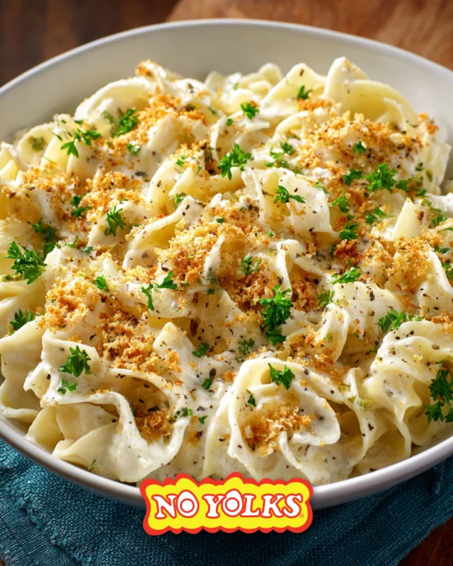 Start December off right with No Yolks Noodles coated in a rich garlic cream sauce topped with crispy bread crumbs and fresh parsley. 🧄❄️ Link in bio for recipe details.